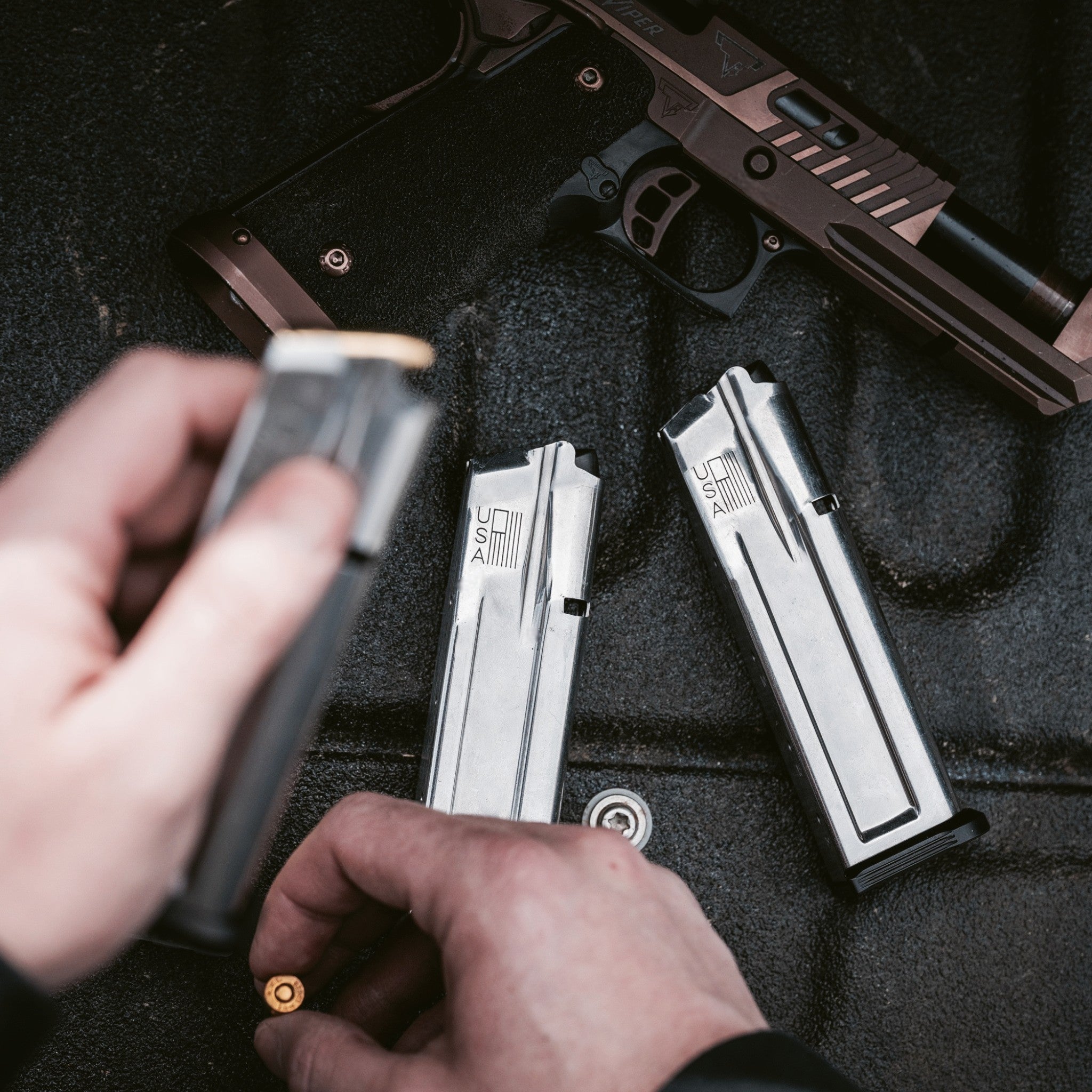 Check-Mate Mags UHC 9mm double stack magazine for 1911 pistols, shown with metal construction and polymer base plate.